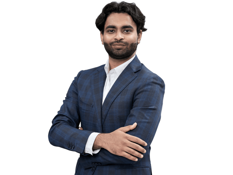 Professional Punjabi transcreation services Uk, Indian man standing with arms folded, looking confidently at the camera.